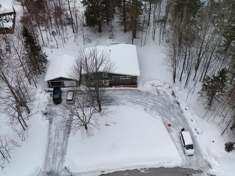 Drone aerial home inspection Rothesay New Brunswick, winter bungalow on a wooded lot