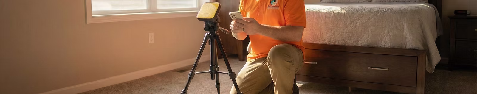 Home Inspector conducting a Radon Test in a basement bedroom.